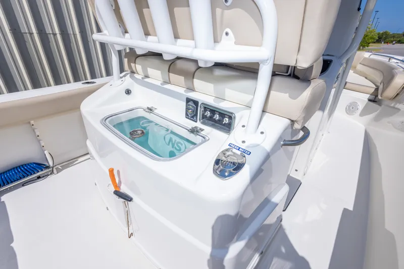 Slide: The Image of 2017 NauticStar 2602 Legacy boat interior with seating and control panel. - 37