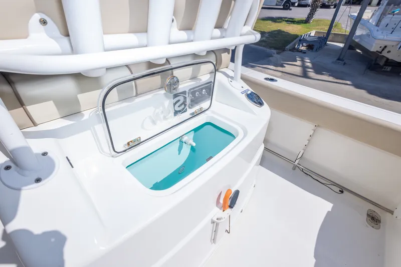 Slide: The Image of 2017 NauticStar 2602 Legacy boat with livewell and rod holders. - 38