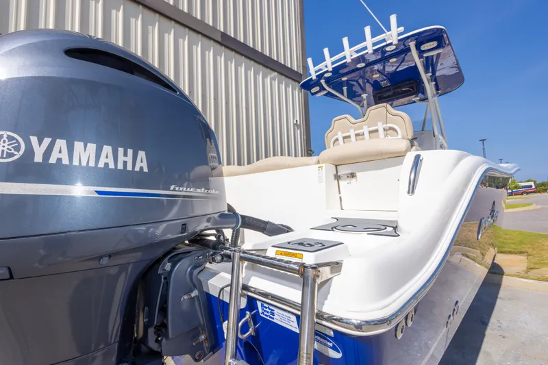 Slide: The Image of 2017 NauticStar 2602 Legacy boat with Yamaha engine, docked outdoors. - 48