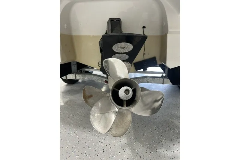 Slide: The Image of 2023 Monterey 238SS Super Sport boat propeller in a garage setting. - 18