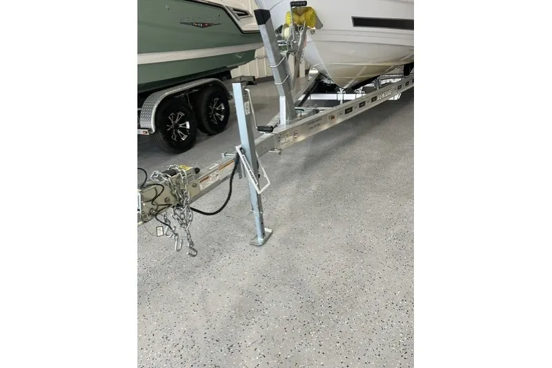 Slide: The Image of 2023 Monterey 238SS Super Sport boat on trailer in showroom. - 19