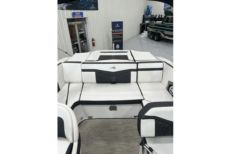Slide: The Image of 2023 Monterey 238SS Super Sport boat interior with white and black seating. - 13