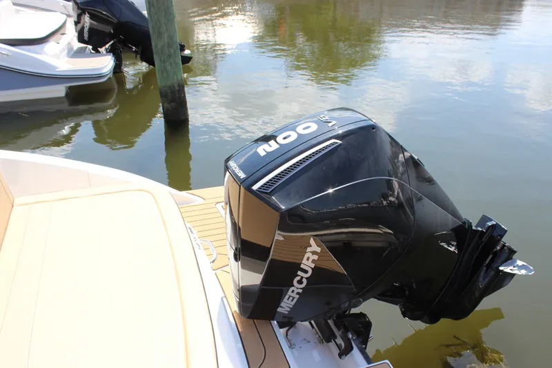 Slide: The Image of 2025 Sea Ray SPX 210 Outboard with Mercury engine on calm water. - 5