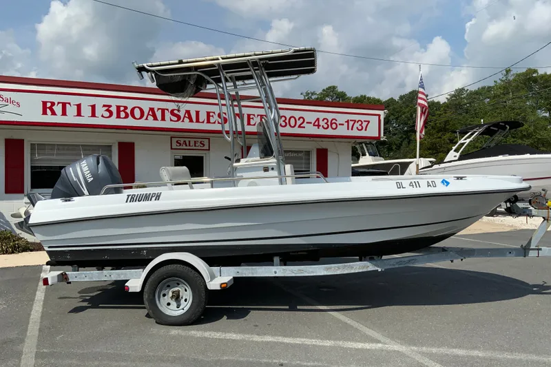 The Image of 2004 Triumph 190 Bay boat on trailer at RT113 Boat Sales dealership. - 1