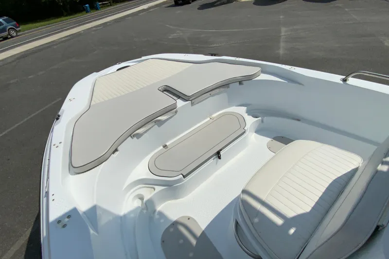 Slide: The Image of 2004 Triumph 190 Bay boat interior with cushioned seating and storage compartments. - 16