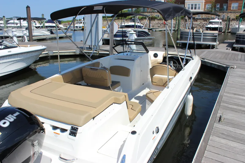 Slide: The Image of 2026 Bayliner VR6 Bowrider OB docked, featuring spacious seating and sleek design. - 5