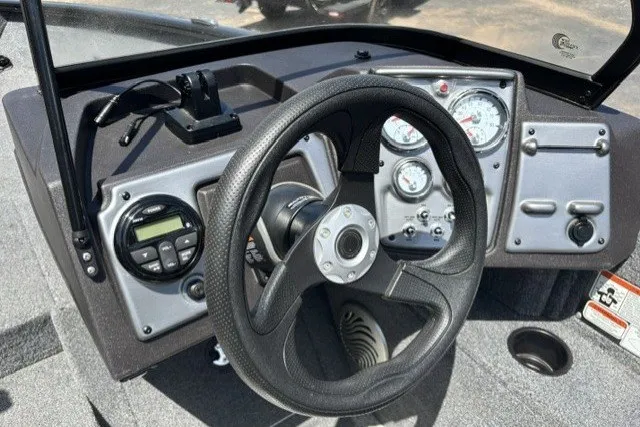 Slide: The Image of 2023 Tracker Pro Guide V-175 Combo boat dashboard with steering wheel and gauges. - 17