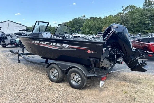 The Image of 2023 Tracker Pro Guide V-175 Combo boat on trailer, parked outdoors. - 1