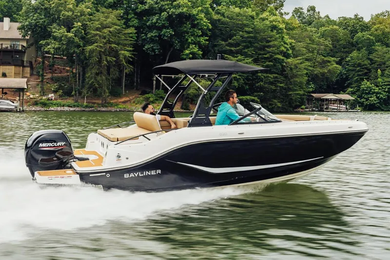 The Image of Manufacturer Provided Image: 2025 Bayliner D20 boat cruising on a lake with lush green trees in the background. - 1