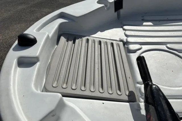 Slide: The Image of Interior of a 2003 Pelican Predator boat showing seating and paddle. - 8