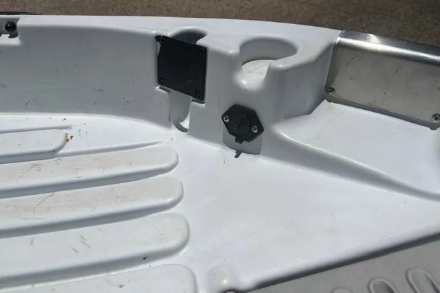 Slide: The Image of Interior of a 2003 Pelican Predator boat showing seating and cup holder. - 17