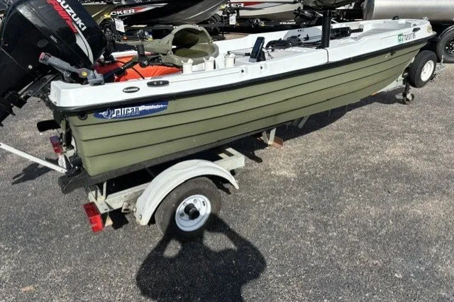Slide: The Image of 2003 Pelican Predator boat on trailer with Suzuki outboard motor. - 4