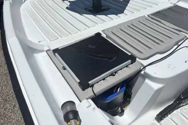 Slide: The Image of Pelican Predator 2003 boat interior with solar panel and storage compartment. - 19