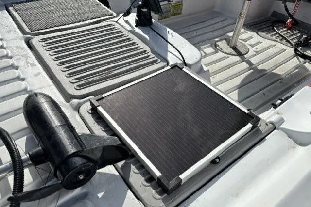 Slide: The Image of Solar panel on a 2003 Pelican Predator boat deck, surrounded by equipment. - 9