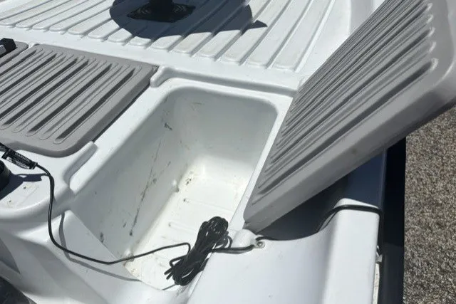 Slide: The Image of Open storage compartment on a 2003 Pelican Predator boat deck. - 15