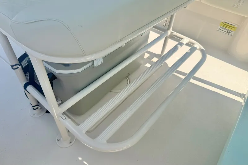 Slide: The Image of 2027 Carolina Skiff 26 Ultra Elite boat seating with storage rack and cooler. - 25