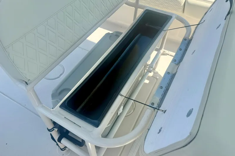 Slide: The Image of Open storage compartment on 2027 Carolina Skiff 26 Ultra Elite boat. - 26