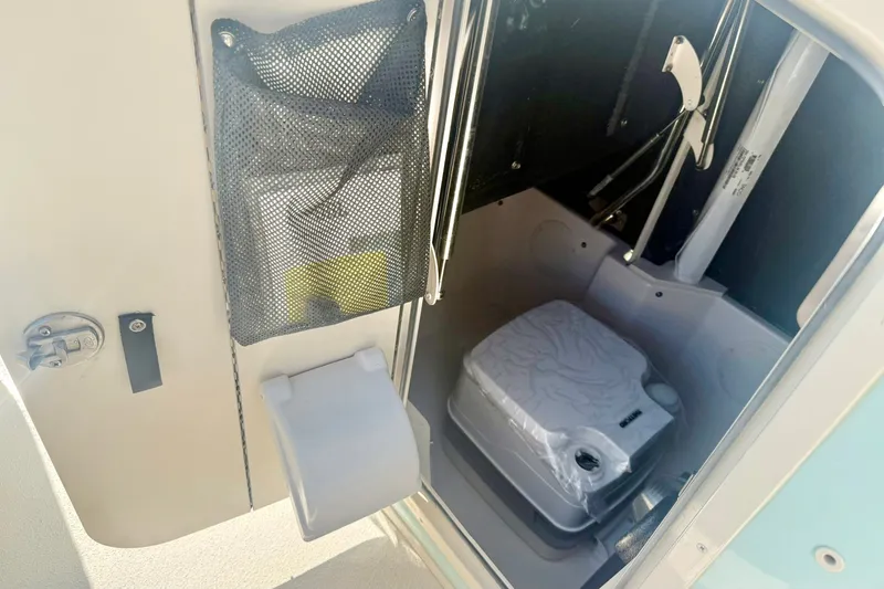 Slide: The Image of Interior of 2027 Carolina Skiff 26 Ultra Elite boat with compact toilet. - 29
