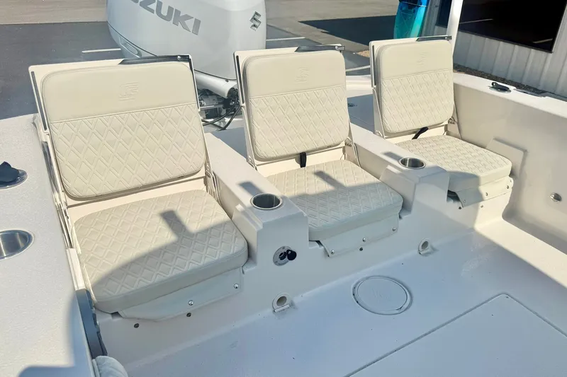 Slide: The Image of 2027 Carolina Skiff 26 Ultra Elite boat seats with diamond-pattern upholstery. - 32