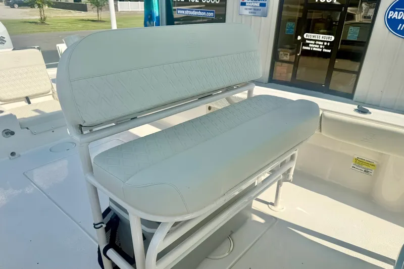 Slide: The Image of 2027 Carolina Skiff 26 Ultra Elite boat interior with white cushioned seating. - 23