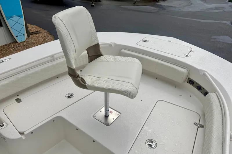 Slide: The Image of 2027 Carolina Skiff 26 Ultra Elite boat with white seating and deck details. - 13