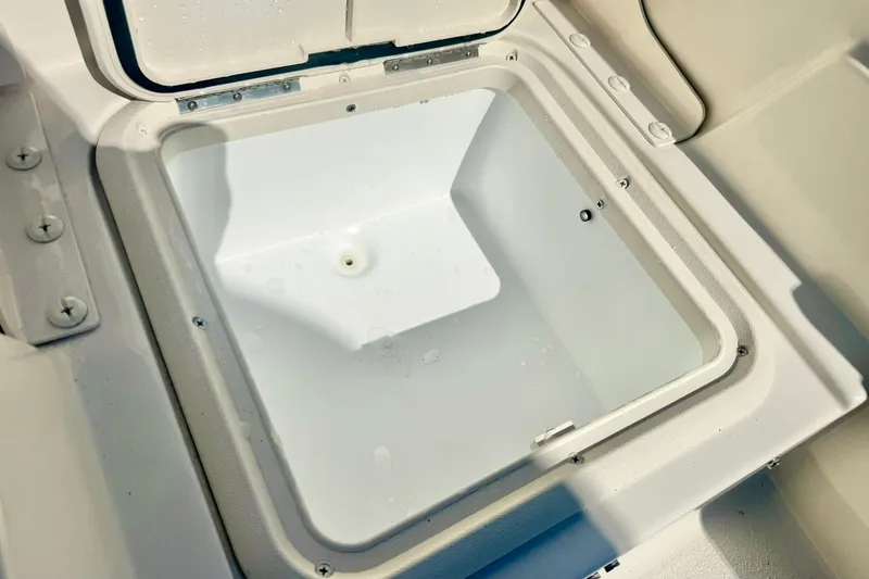 Slide: The Image of Open storage compartment on 2027 Carolina Skiff 26 Ultra Elite boat. - 34