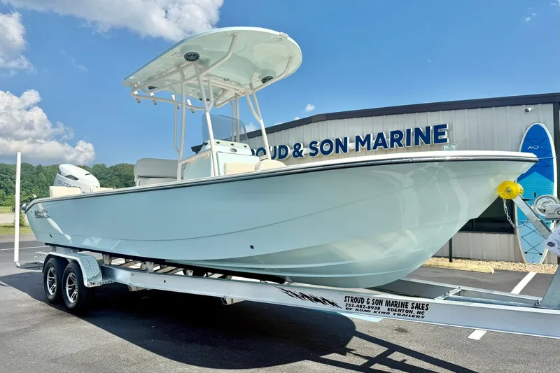 The Image of 2027 Carolina Skiff 26 Ultra Elite boat on trailer at marine dealership. - 1