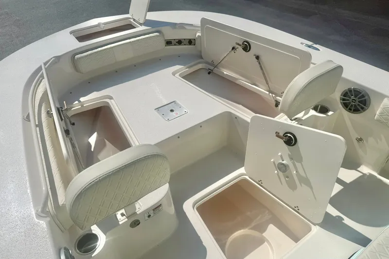 Slide: The Image of Interior view of 2027 Carolina Skiff 26 Ultra Elite boat with open storage compartments. - 14
