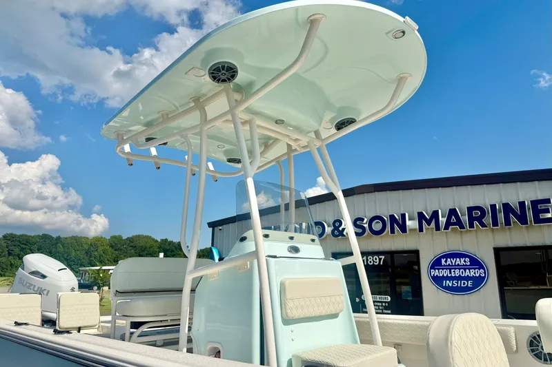 Slide: The Image of 2027 Carolina Skiff 26 Ultra Elite boat at a marine dealership. - 47