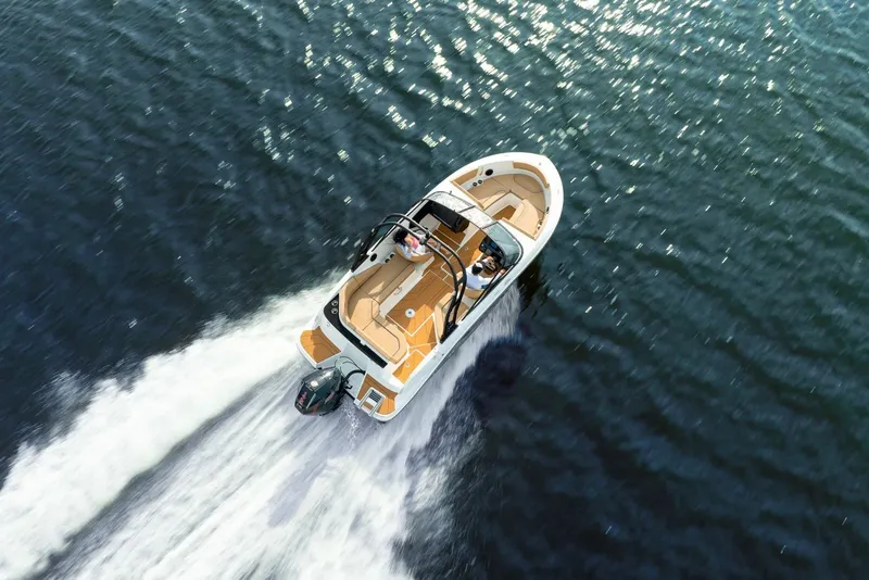 Slide: The Image of Aerial view of 2026 Bayliner V20 speedboat cruising on open water. - 8