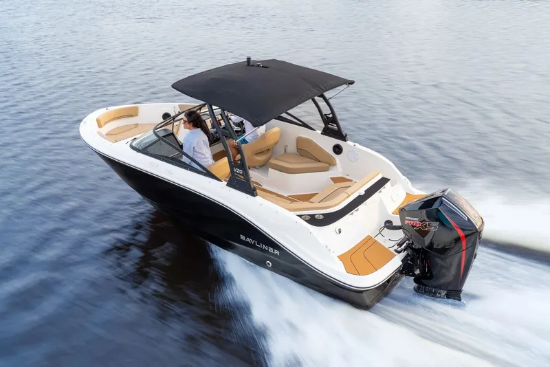 Slide: The Image of 2026 Bayliner V20 boat cruising on water with passengers. - 6