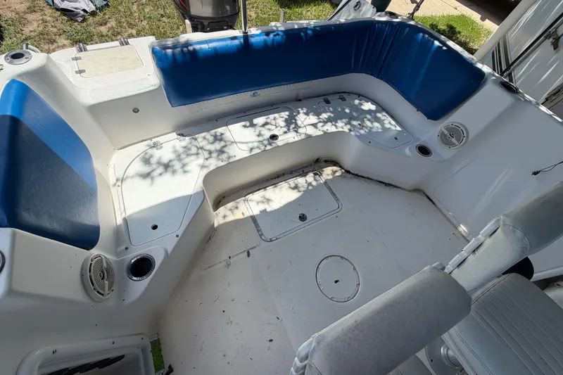 Slide: The Image of 2012 Hurricane Center Console 231 OB boat interior with blue seating and white deck. - 17