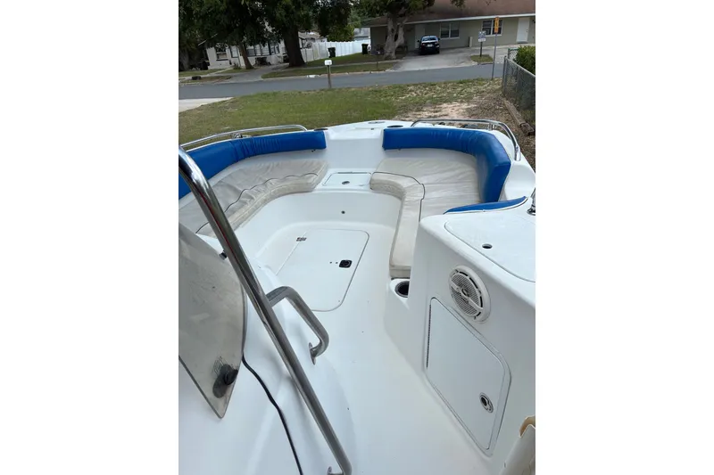 Slide: The Image of 2012 Hurricane Center Console 231 OB boat with spacious seating and blue accents. - 6