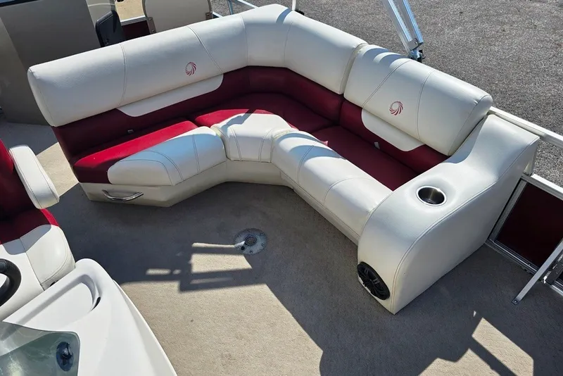 Slide: The Image of 2013 Lowe SF 214 Sport Fish boat interior with red and white seating. - 6
