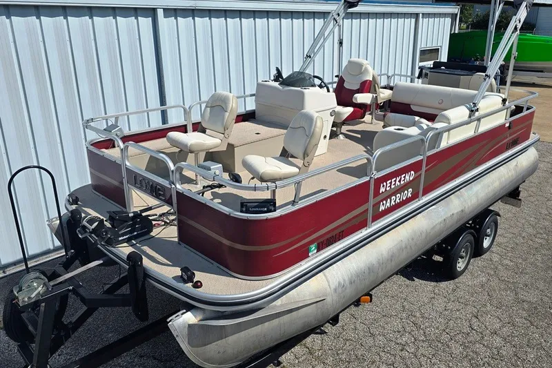 The Image of 2013 Lowe SF 214 Sport Fish pontoon boat on trailer, red and white design. - 0