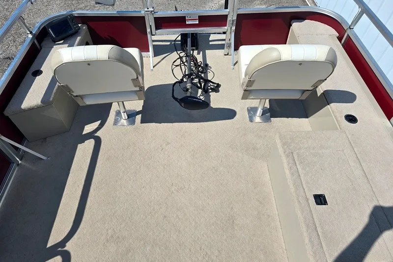 Slide: The Image of 2013 Lowe SF 214 Sport Fish boat interior with two seats and fishing equipment. - 4