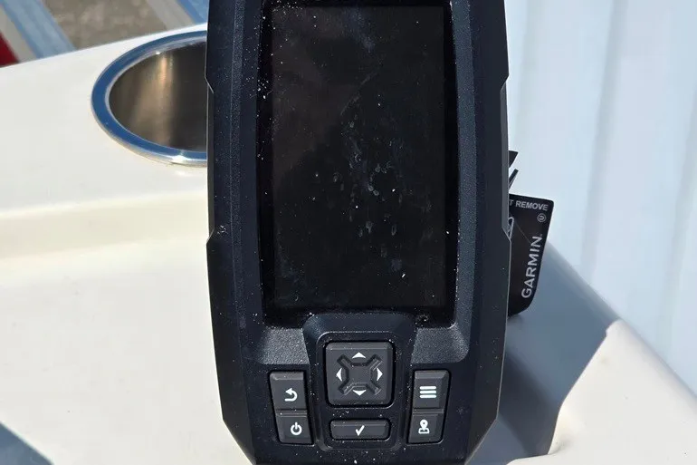 Slide: The Image of Garmin fishfinder on 2013 Lowe SF 214 Sport Fish boat dashboard. - 14