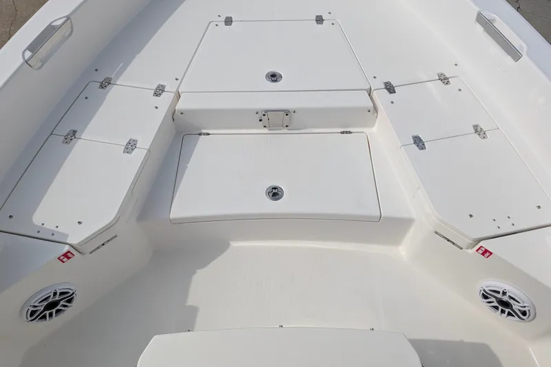 Slide: The Image of The image shows the deck of a 2027 Pathfinder 2400 Hybrid boat with multiple storage compartments. - 27