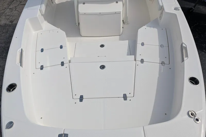 Slide: The Image of The image shows the deck of a 2027 Pathfinder 2400 Hybrid boat with multiple storage compartments. - 30