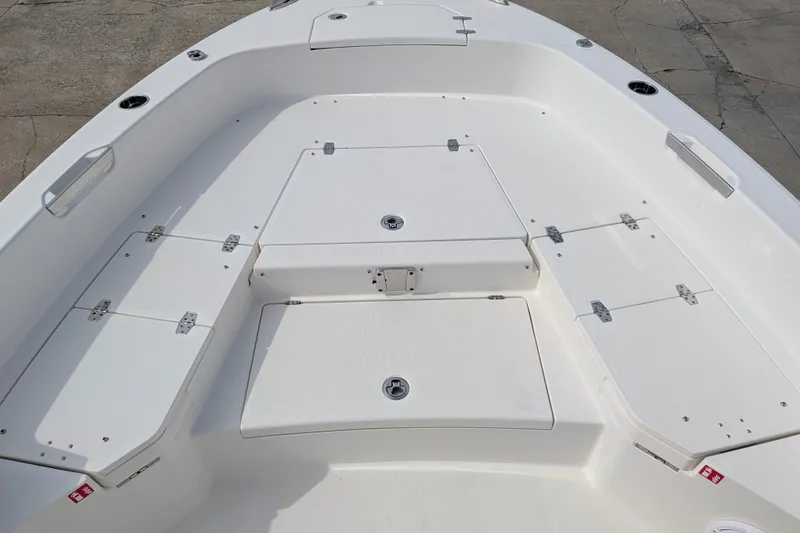 Slide: The Image of The image shows the spacious, white deck of a 2027 Pathfinder 2400 Hybrid boat. - 26