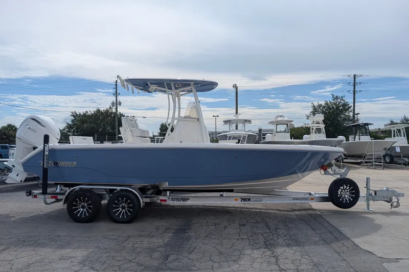 The Image of A 2027 Pathfinder 2400 Hybrid boat on a trailer, ready for transport. - 0