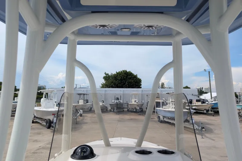 Slide: The Image of View from the helm of a Pathfinder 2400 Hybrid, overlooking a boatyard with several boats in the background. - 20
