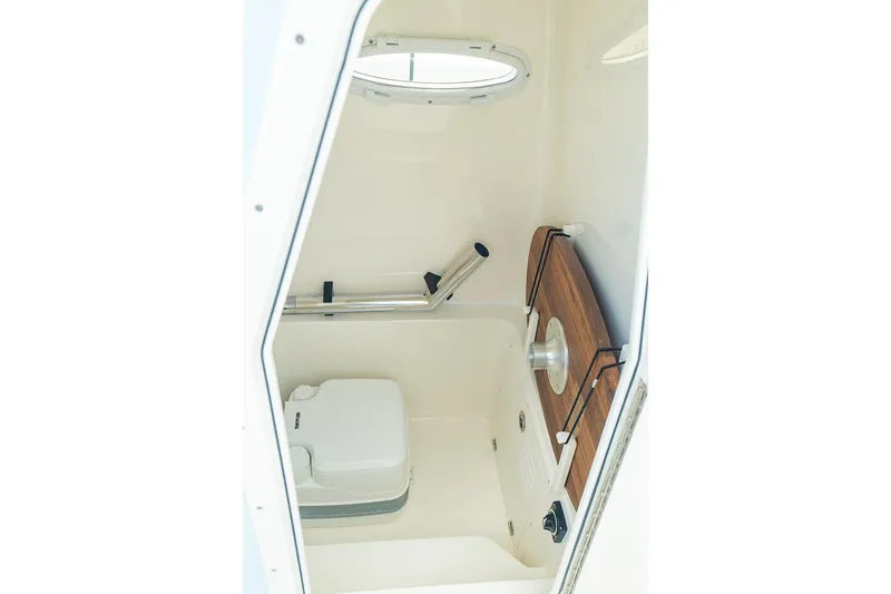 Slide: The Image of Manufacturer Provided Image: Interior of 2027 Pathfinder 2400 Hybrid boat, featuring compact cabin amenities. - 22