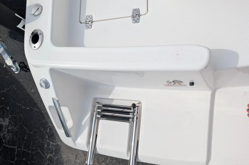 Slide: The Image of The image shows the stern of a Pathfinder 2400 Hybrid with a swim ladder and hatch. - 15