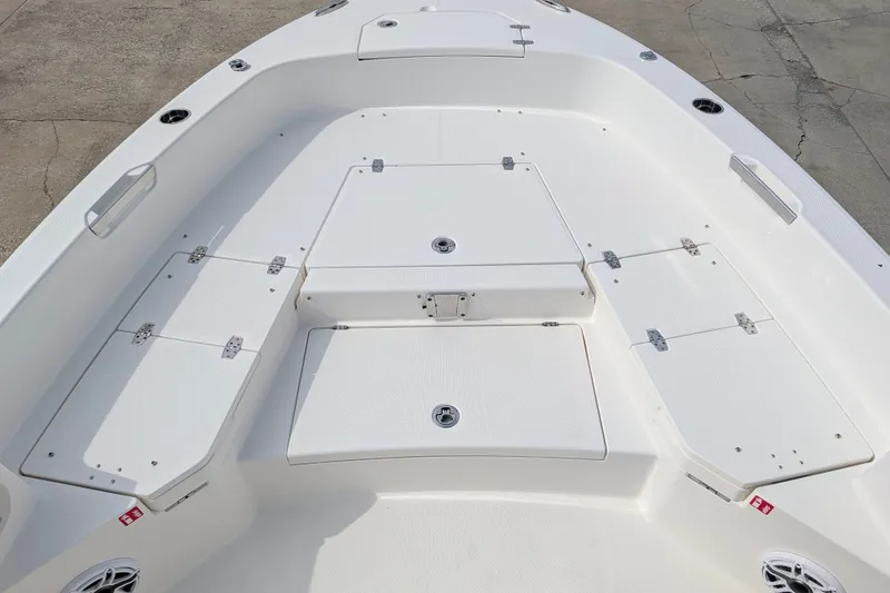 Slide: The Image of The image shows the deck of a 2027 Pathfinder 2400 Hybrid boat with storage hatches. - 28
