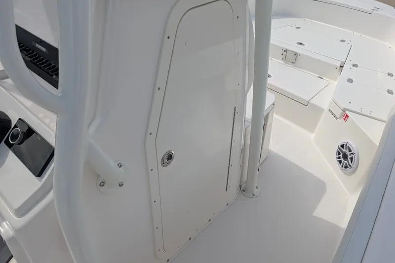 Slide: The Image of The image shows the cockpit of a 2027 Pathfinder 2400 Hybrid with white surfaces and a speaker. - 21