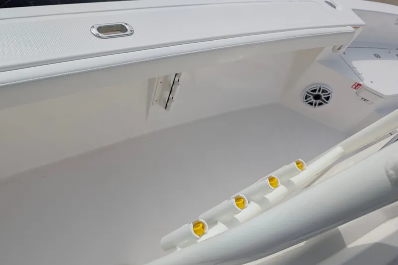 Slide: The Image of The image shows the deck of a 2027 Pathfinder 2400 Hybrid boat with rod holders. - 17