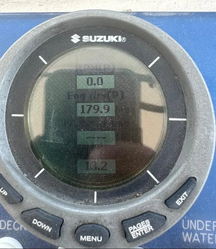 Slide: The Image of Suzuki marine gauge on 2000 Baha Cruisers 272 Sportfish boat displaying engine data. - 18