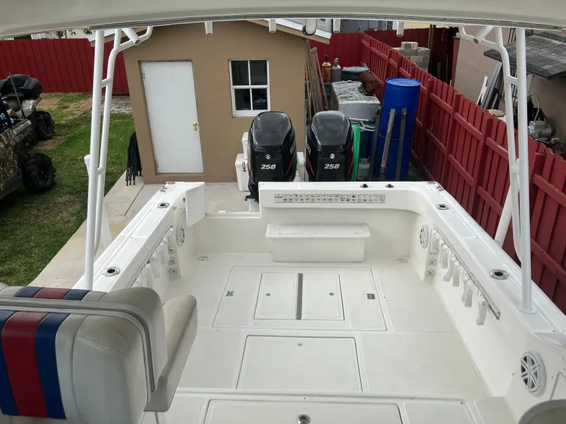 Slide: The Image of 2000 Baha Cruisers 272 Sportfish boat with dual 250 HP engines in backyard. - 22