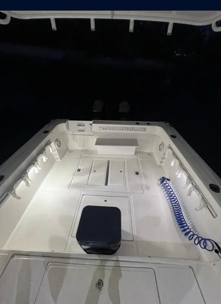 Slide: The Image of 2000 Baha Cruisers 272 Sportfish boat deck illuminated at night. - 10